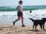 Jogging_with_dog_at_Carcavelos_Beach.jpg